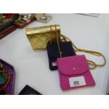 Two small Chanel purses and an Estee Lauder example