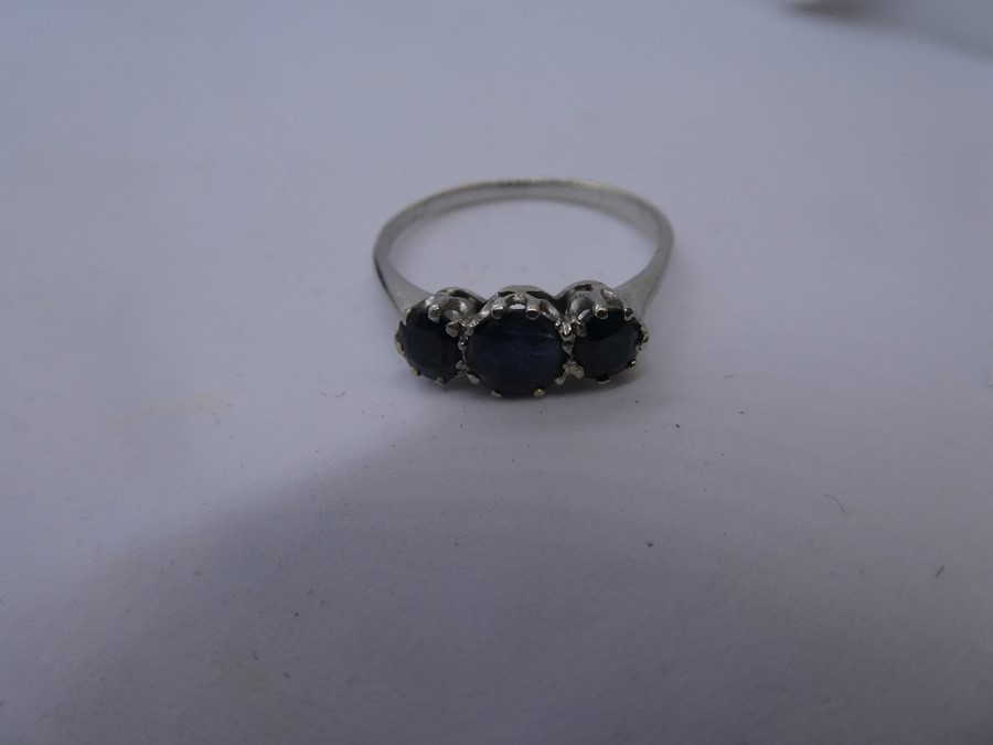 Unmarked white gold three stone Sapphire set ring, size U, gross weight approx 2.5g