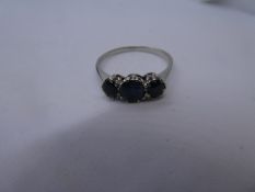 Unmarked white gold three stone Sapphire set ring, size U, gross weight approx 2.5g