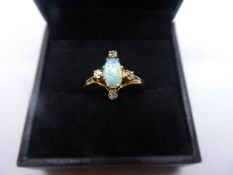 Yellow gold dress ring set with central cabochon opal on 4 approx 0.05 carat diameter, size T