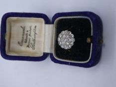 18ct and Platinum diamond cluster ring comprising 24 brilliant cut diamonds, marked ME 18ct and PLAT
