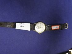 A vintage gent's Aucre wristwatch, winds and ticks