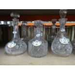 A selection of glass decanters, some with labels and vintage soda syphons