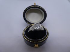Art Deco diamond ring with central diamond on stepped shank, inset with smaller diamonds, central di