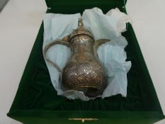 A very decorative silver jug of ornate design, possibly from Israel, marked 925, 17cm high, approx 6