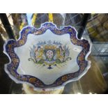 A French Faience Armorial plate having shaped rim, possibly 18th Century 27.5cm and a Chinese export