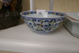 A Chinese bowl decorated flowers and scrolls, 14cms