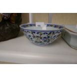 A Chinese bowl decorated flowers and scrolls, 14cms