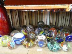 A selection of glass paperweights, including one by Wedgwood