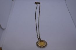 9ct yellow gold belcher chain, hug with a 9ct gold mounted half Sovereign dated 1905, chain marked 3