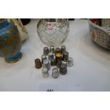 A small quantity of thimbles, some silver and a silver coloured glass bowl