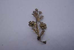 9ct yellow gold brooch in the form of a floral spray inset with seed pearls, marked 9ct, 5.5cm appro