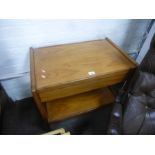 A 1970's teak two tier tea trolley having one drawer