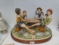 Capodimonte, a large figural group of four card players titled cheats on wooden base