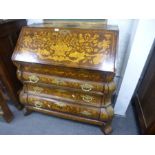 An antique Dutch marquetry bombe bureau having well interior with three long drawers 120cm