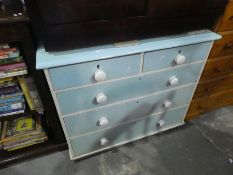 A vintage painted light blue chest of drawers 2 short over 3 long with white handles
