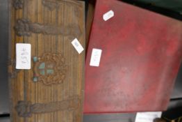 A metal chest of coins and a red case of old coins to include pennies and six pence etc