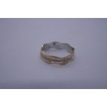 18ct yellow and white gold wave design ring set with small diamond chips, marked 750, Size P, 2.9g