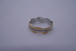 18ct yellow and white gold wave design ring set with small diamond chips, marked 750, Size P, 2.9g