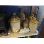 A selection of stoneware jugs, one inscribed R-White Brewery, London & Birmingham