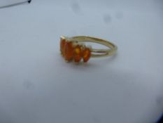 Modern 9ct yellow gold dress ring set with marquise orange stones, marked 9K, size P