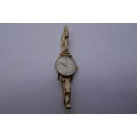 Vintage 9ct yellow gold ladies 'Omega' wristwatch with champagne dial and gold numbers, 3 strap link