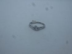 Platinum diamond ring in pretty crossover setting, central diamond approx 0.25 carat, inscribed FORE