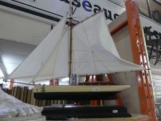 Wooden model of a sailing ship on plinth named ;The Lady Linda'