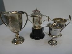 A selection of four smaller trophy cups all silver hallmarks, total weight 3.68 ozt