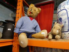 A vintage bear and much loved vintage Lion with zip for night clothes and a shelf of teddy bears