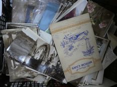 A box of assorted ephemera, mostly containing post and cigarette cards