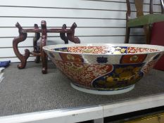A 20th Century Chinese bowl, interior decorated with fish 68cm on wooden stand