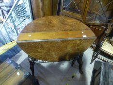 Drop leaf coffee table on ornate carved supports