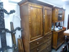 Antique mahogany linen press having sliding shelves on bracket feet