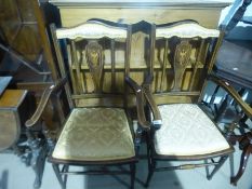Pair of mahogany dining chairs upholstered in gold fabric with inlaid decoration