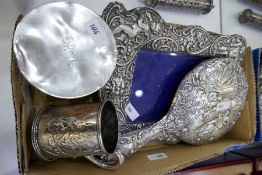 A mixed lot comprising a silver cup, silver bracelet and pendant, silver backed mirror, silver to