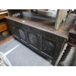 Antique oak coffer having panelled front with carved decoration, 135 cm