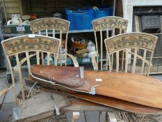 Four decorative heavy iron chairs, requiring new seats