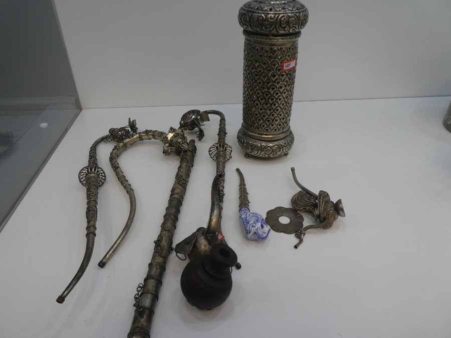 A selection of possibly Chinese white metal pipes and other artefacts, with possibly Indian white me