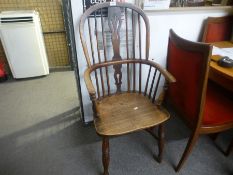 An antique oak and elm Windsor armchair