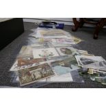 A quantity of old post cards, a flag and sundry items