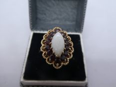 Victorian style 9ct yellow gold Marquise cut white Opal set ring surrounded garnets, size Q/R, 5.1g