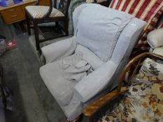 Fireside grey armchair on wooden feet