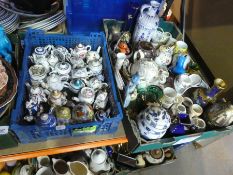 Four boxes of collectables to include small china teapots, collector's plates, jugs, bowls, etc