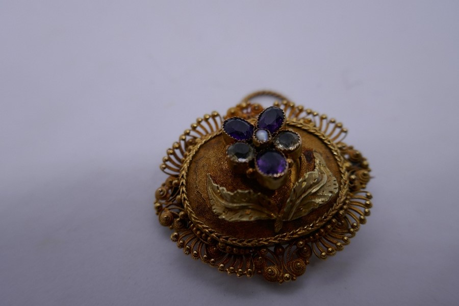Unmarked yellow metal mourning brooch/pendant inset with amethyst and clear stones, in a floral desi - Image 2 of 2