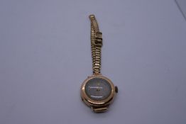 Vintage 9ct yellow gold 15 jewel wristwatch cased marked 375, L.A hinge broken and strap marked 9ct,