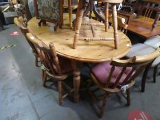 Pine extending table with 6 matching chairs and another similar chair