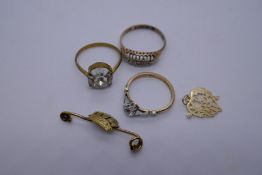 2 9ct yellow gold dress rings,, one set with a clear stone, 3.7g, a 9ct yellow gold pendant0.5 and a