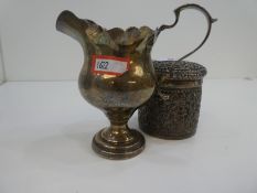 A white metal Indian trinket box along with a silver hallmarked milk jug weighted with lead, possibl