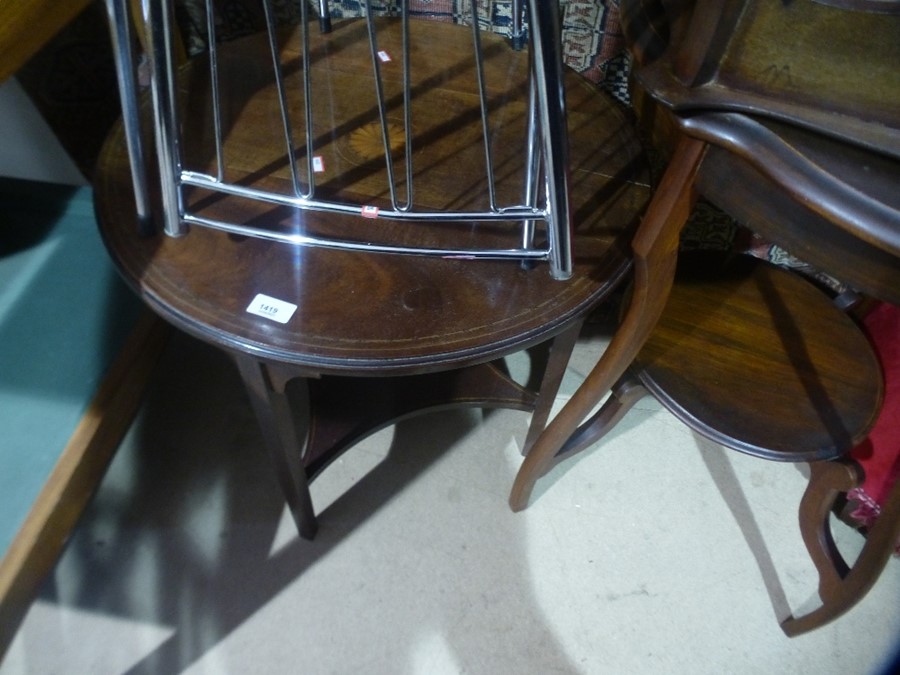 A circular mahogany coffee table with inlaid decoration